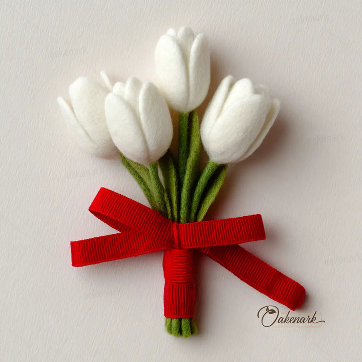 Bouquet of white tulips with a red ribbon on a light background, featuring the brand &