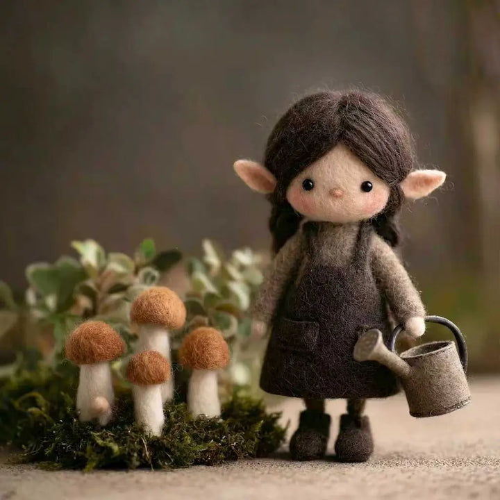 Felted elf doll with a watering can standing next to mushrooms in a forest setting