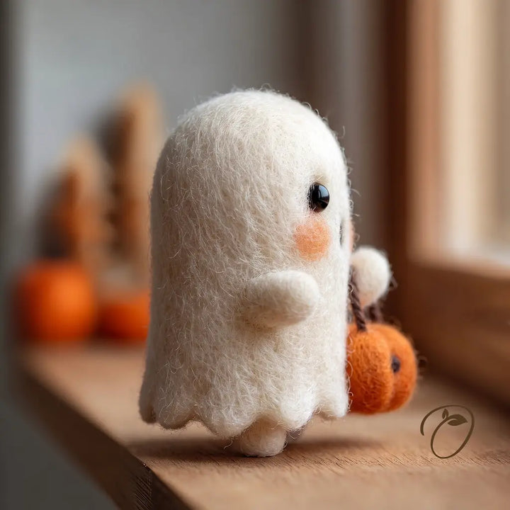 Side view of Pumpkin Basket Ghost felt figurine showing its rounded arm, scalloped hem and tiny feet