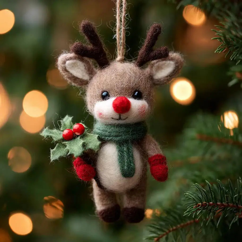Felt reindeer ornament with holly on a Christmas tree