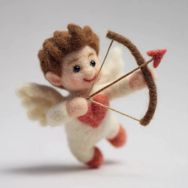 Felted angel figurine with bow and arrow on a light gray background