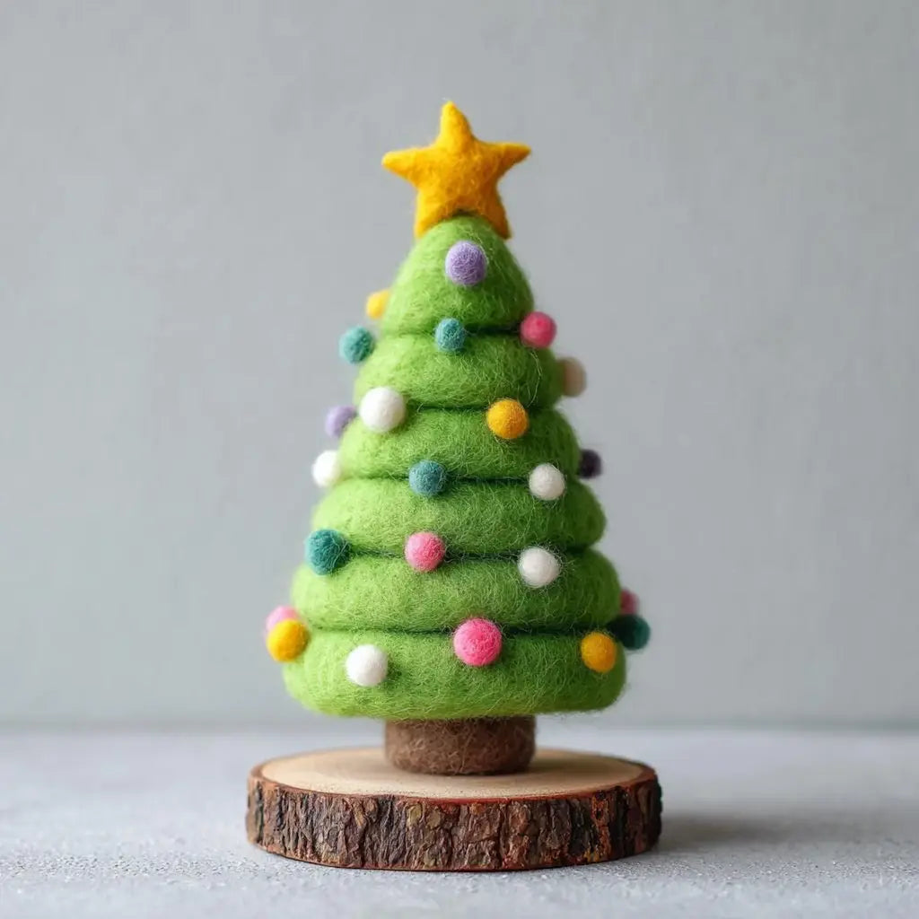 Felt Christmas tree with colorful ornaments and a star on a wooden base against a gray background