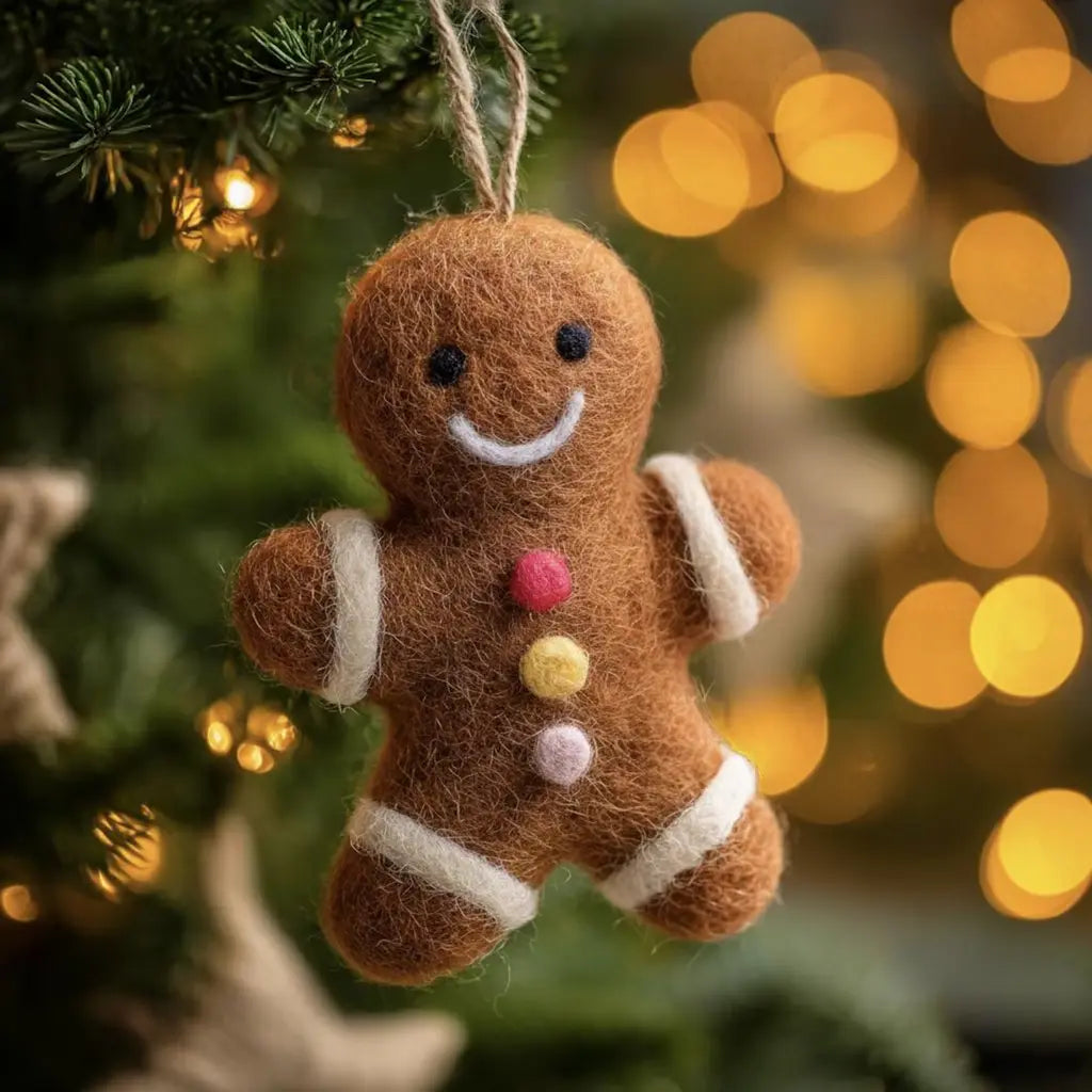 Gingerbread man ornament hanging on a Christmas tree with blurred lights in the background