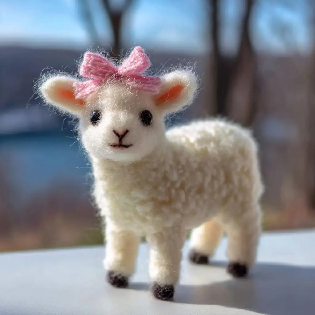 Toy lamb with a pink bow on a blurred natural background