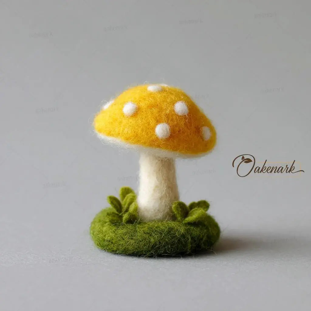Felted mushroom toy with yellow cap and white spots on a gray background, branded &