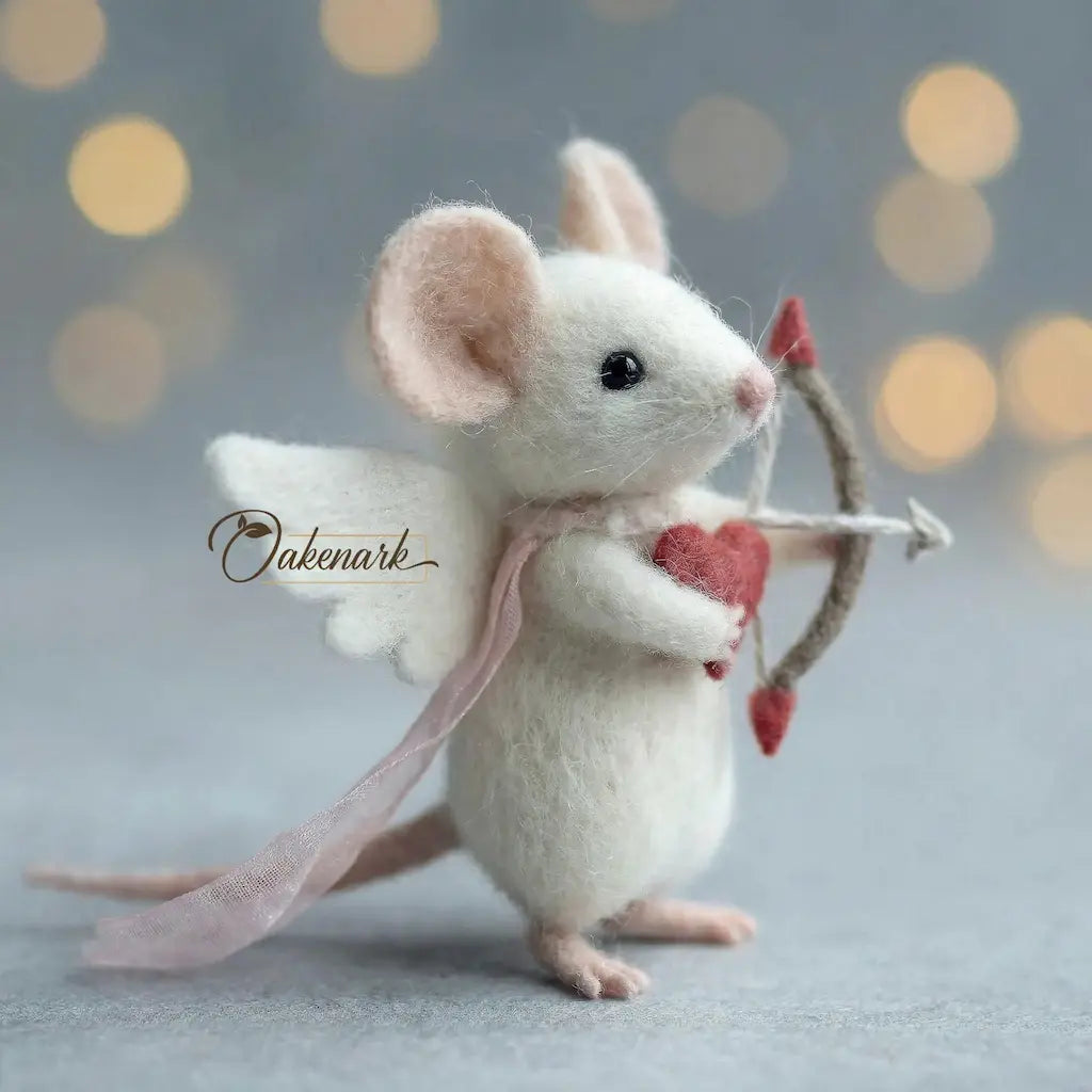 Stuffed mouse toy with a bow and heart, against a blurred background with lights.