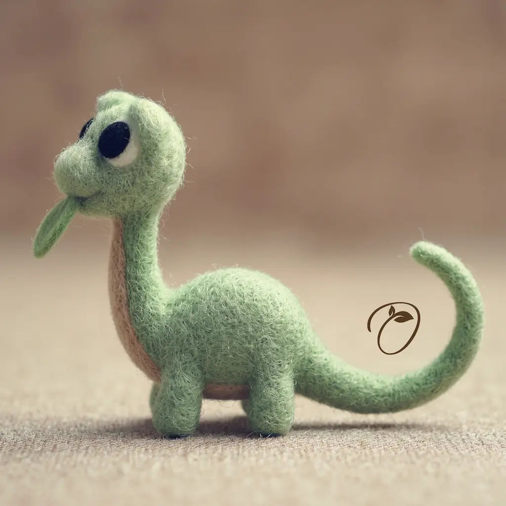 A small felt dinosaur figurine in light green with a tan underside, black eyes, and a curled tail, standing on a soft beige surface against a blurred warm brown background.