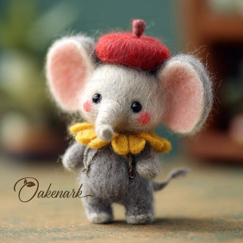 Toy elephant with a red hat and yellow scarf on a textured surface, blurred background