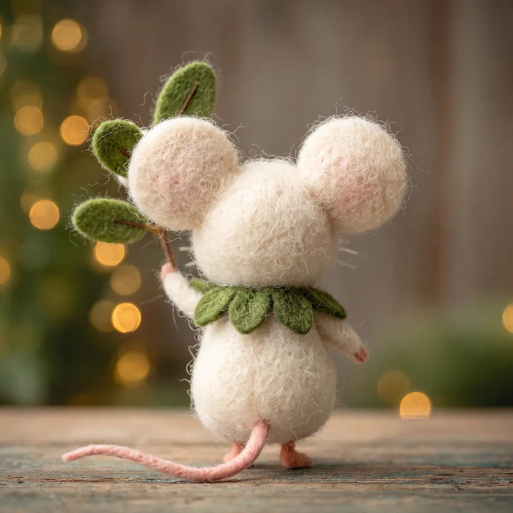 Back view of a white felt mouse showing its rounded ears, green leaf collar and long pink tail