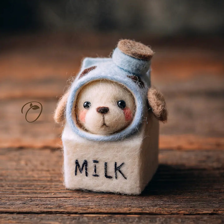 Side view of Milk Carton Puppy wool felt figurine with floppy tan ears