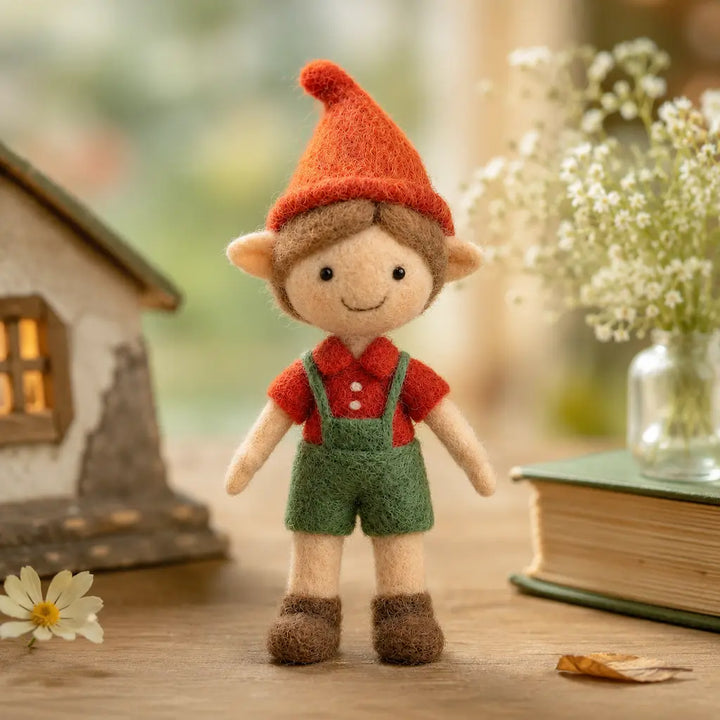 Small figurine of a character with a red hat and green overalls standing on a wooden surface with a blurred background.