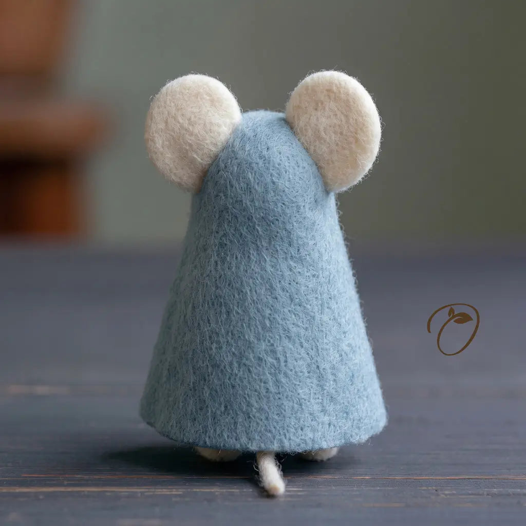 Back view of a handmade felt mouse wearing a soft blue cloak
